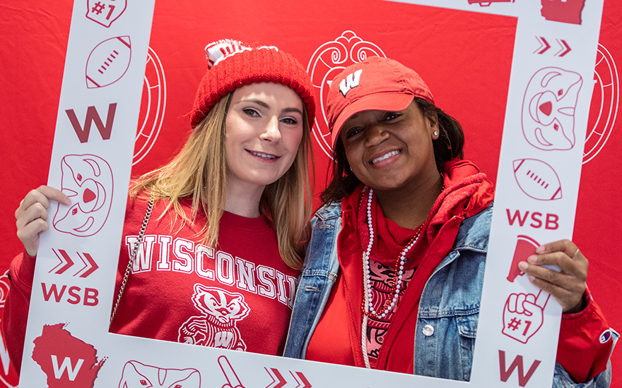 Two alumni posing for a photo