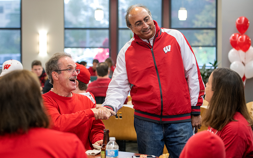 Dean Samba greeting alumni