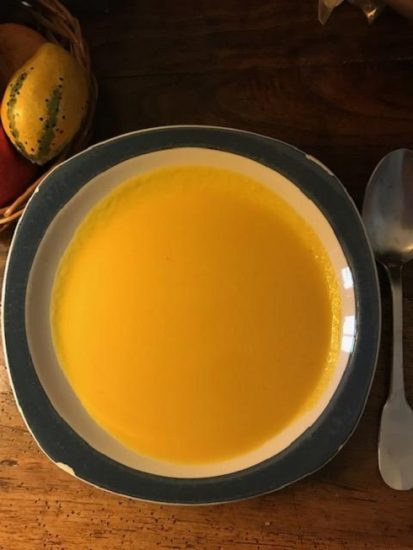 A bowl butternut squash and sweet potato soup