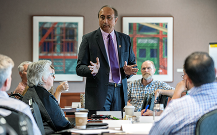 Dean Samba speaks with a group of WSB faculty and staff