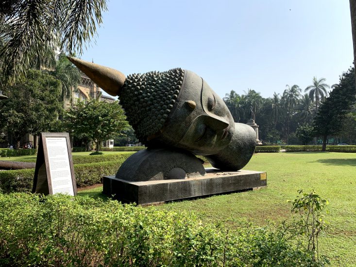 Bhudda head on laying on it's side outside of a museum