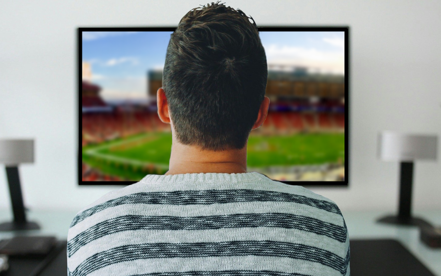 Man Watching a football game Man Watching a football game