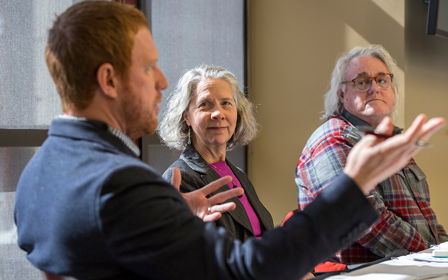 Jonathan O'Connell poses a question to the faculty panelists