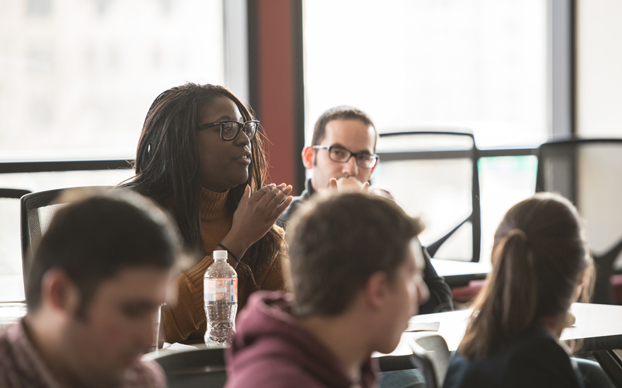 Wisconsin MBA students engage in an open classroom discussion.