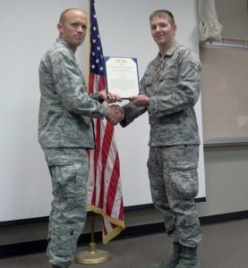 Two people in the U.S. Air Force shake hands