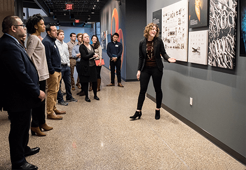 Fiskars employee Blair Brophy gives students a tour