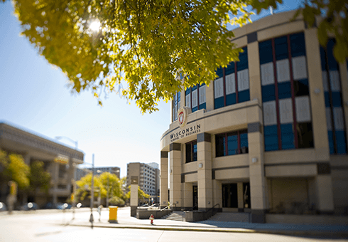 The front entrance of Grainger Hall on a sunny day