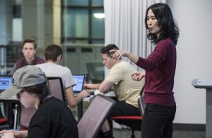 Instructor Yang Wang teaches in an active learning classroom
