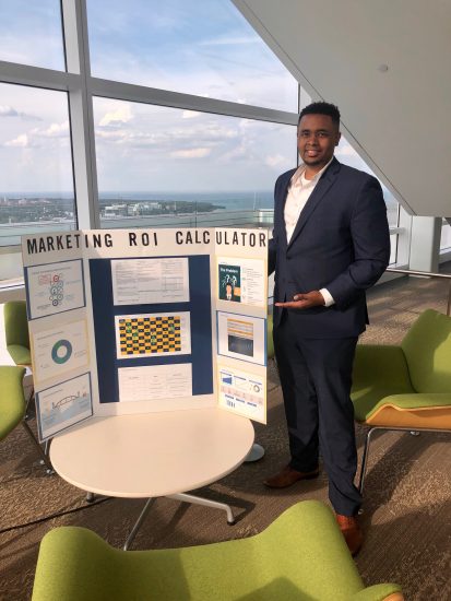 Terry shows a Marketing ROI Calculator poster
