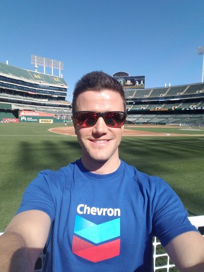 Joshua wears Chevron shirt at baseball stadium event