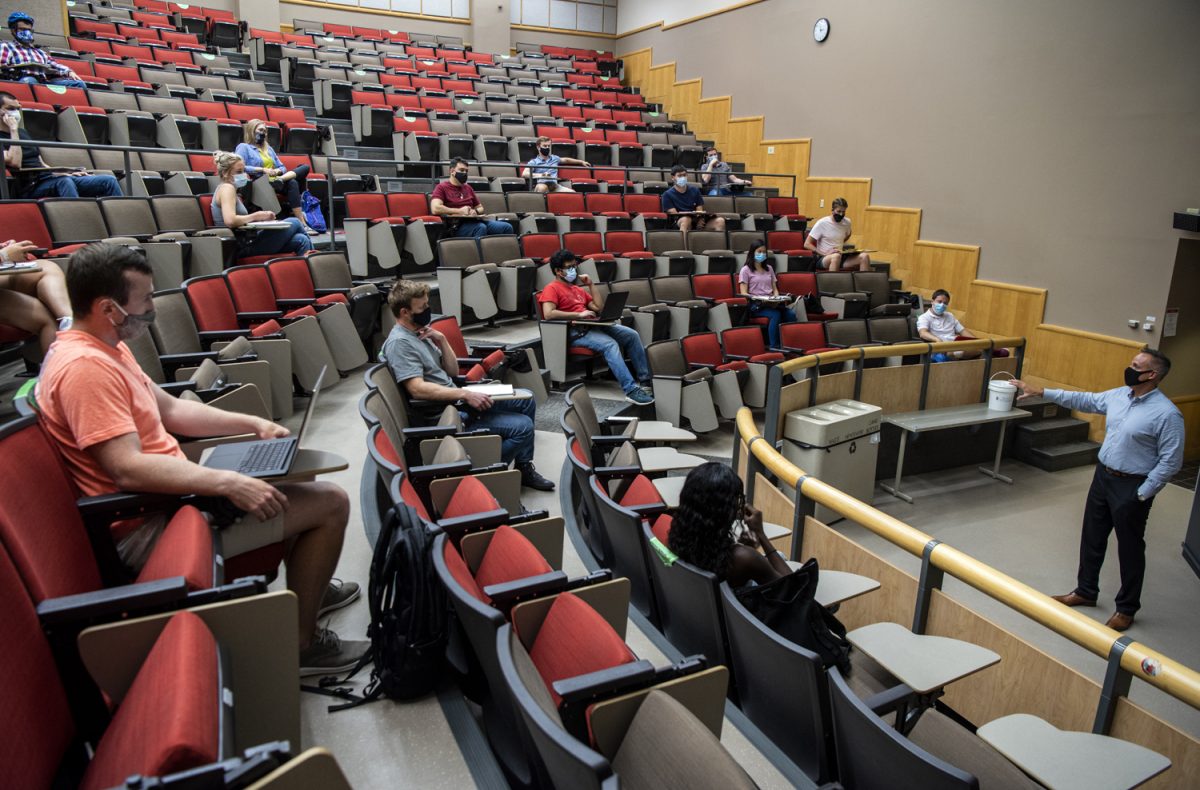 Lecturer Tim Buhl teaches the Marketing Strategic Pricing class in the Morgridge Auditorium on the first day of class