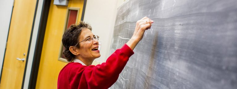 Professor-teaching-on-blackboard